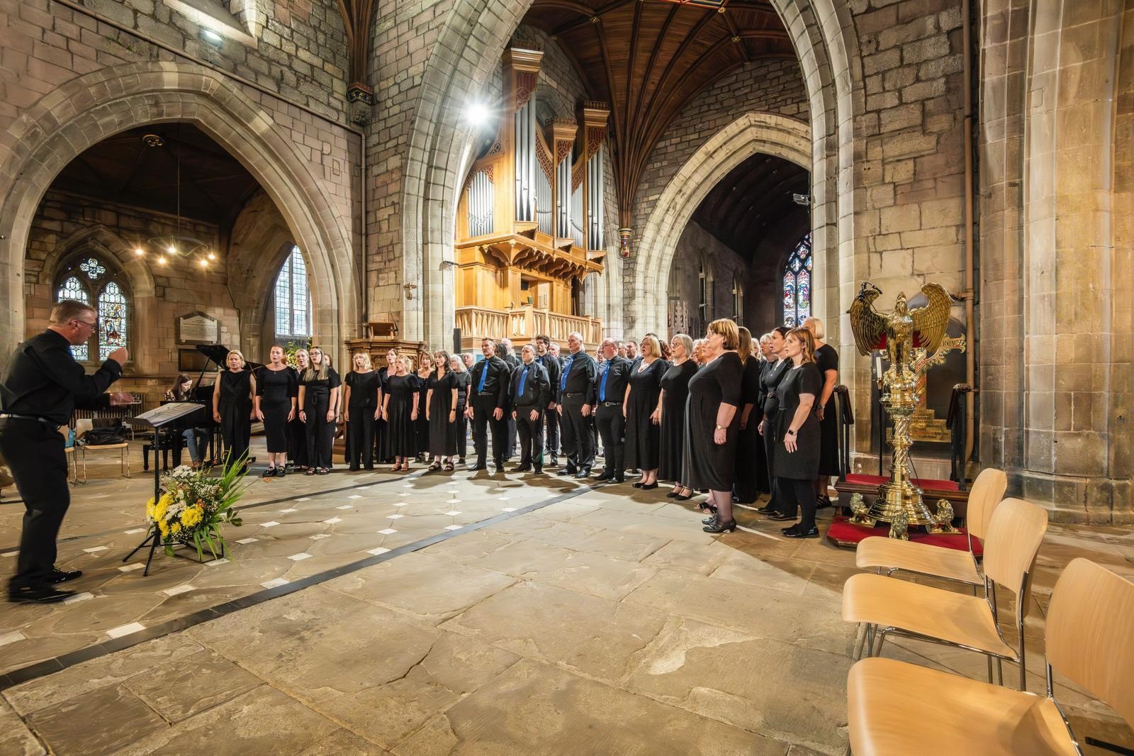 Photograph of the choir signing at St Asaph Cathedral