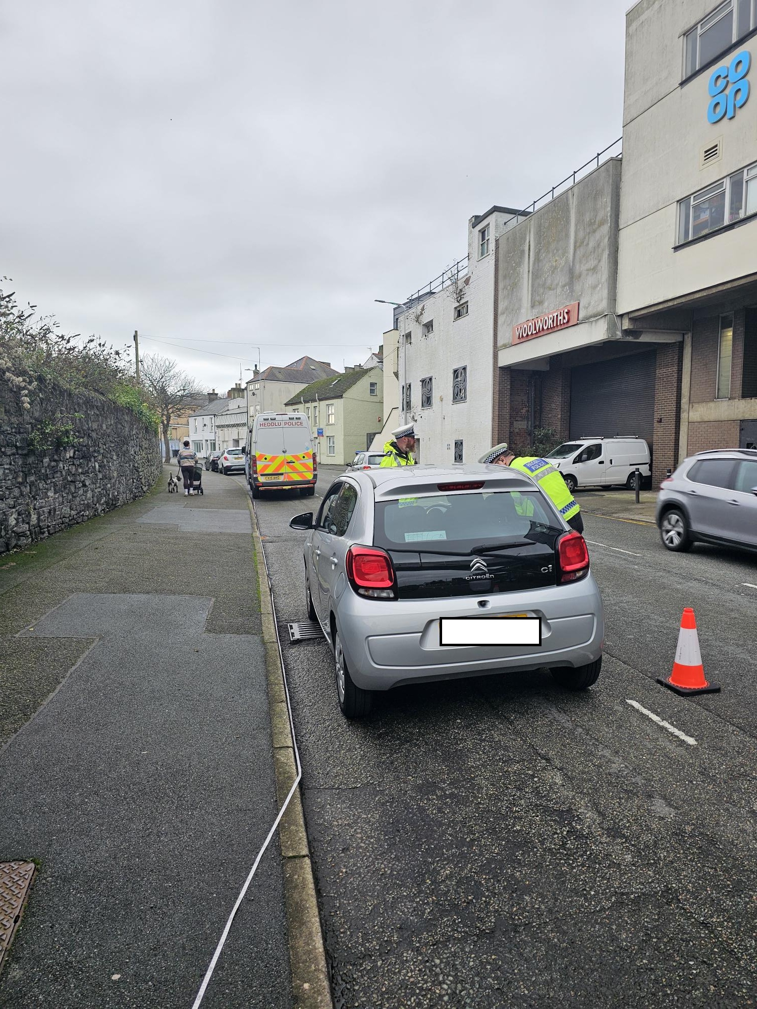 Photograph showing an officer stopping a car