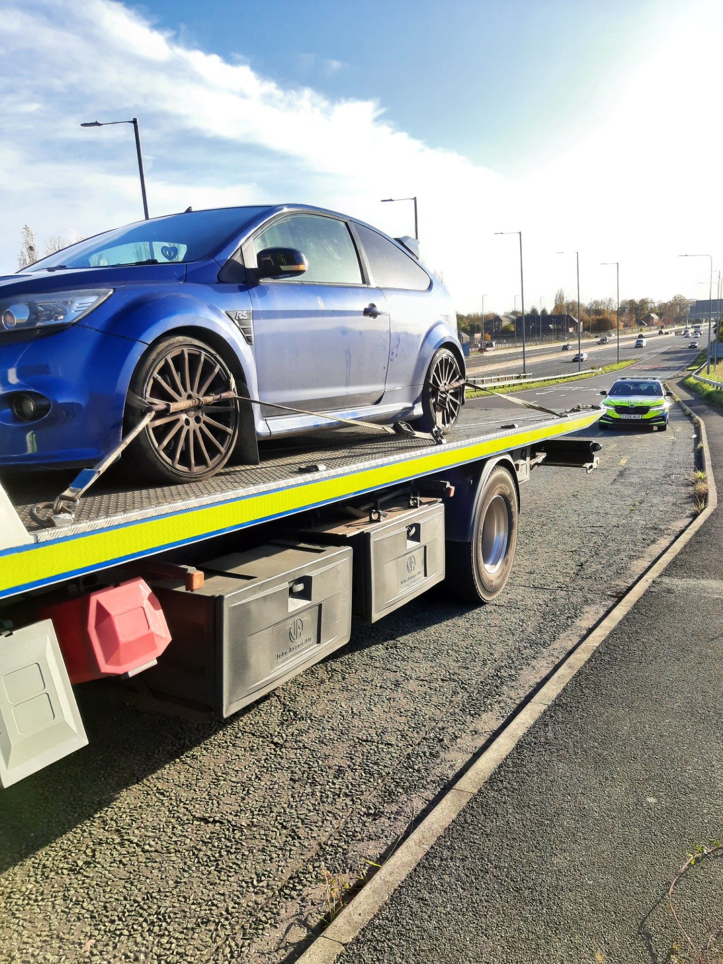 Photograph of a seized car on the side of the A55