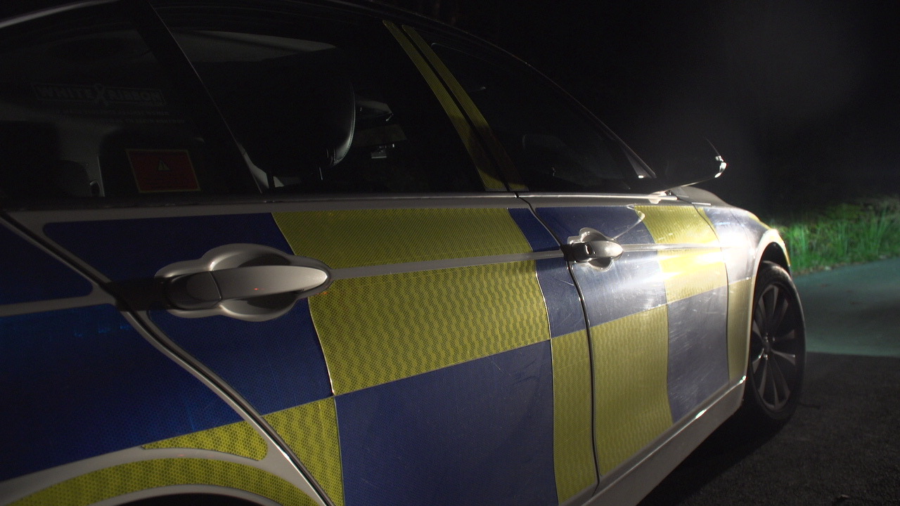 Photograph showing the side of a police car