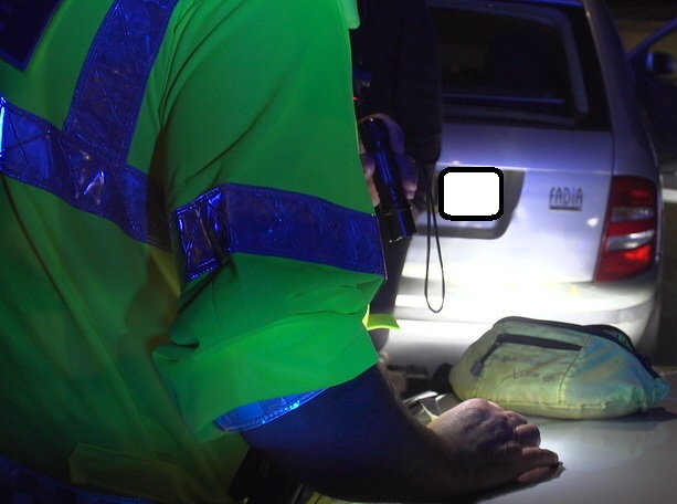 Photograph of a breath test kit on a car bonnet
