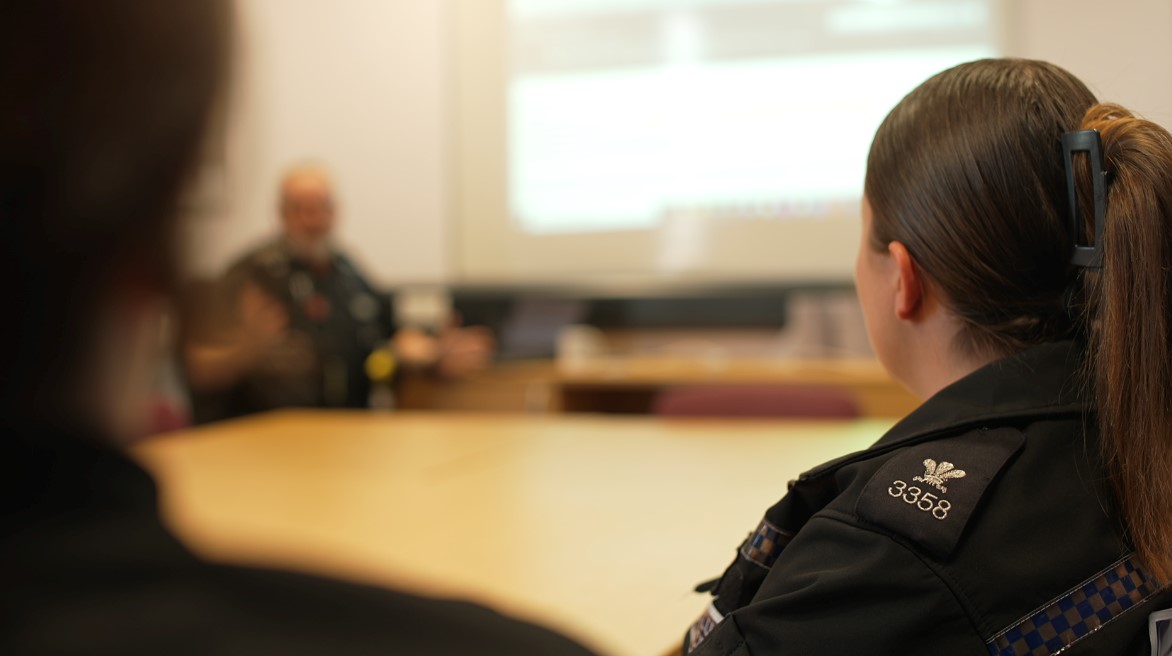 Photograph of police officers in a briefing