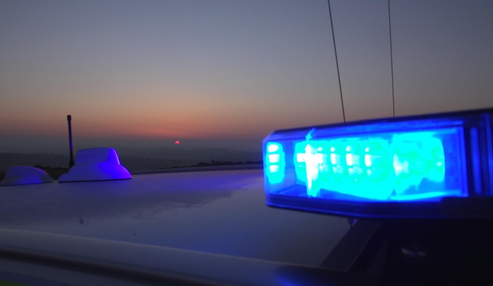 Photograph showing a police car blue light